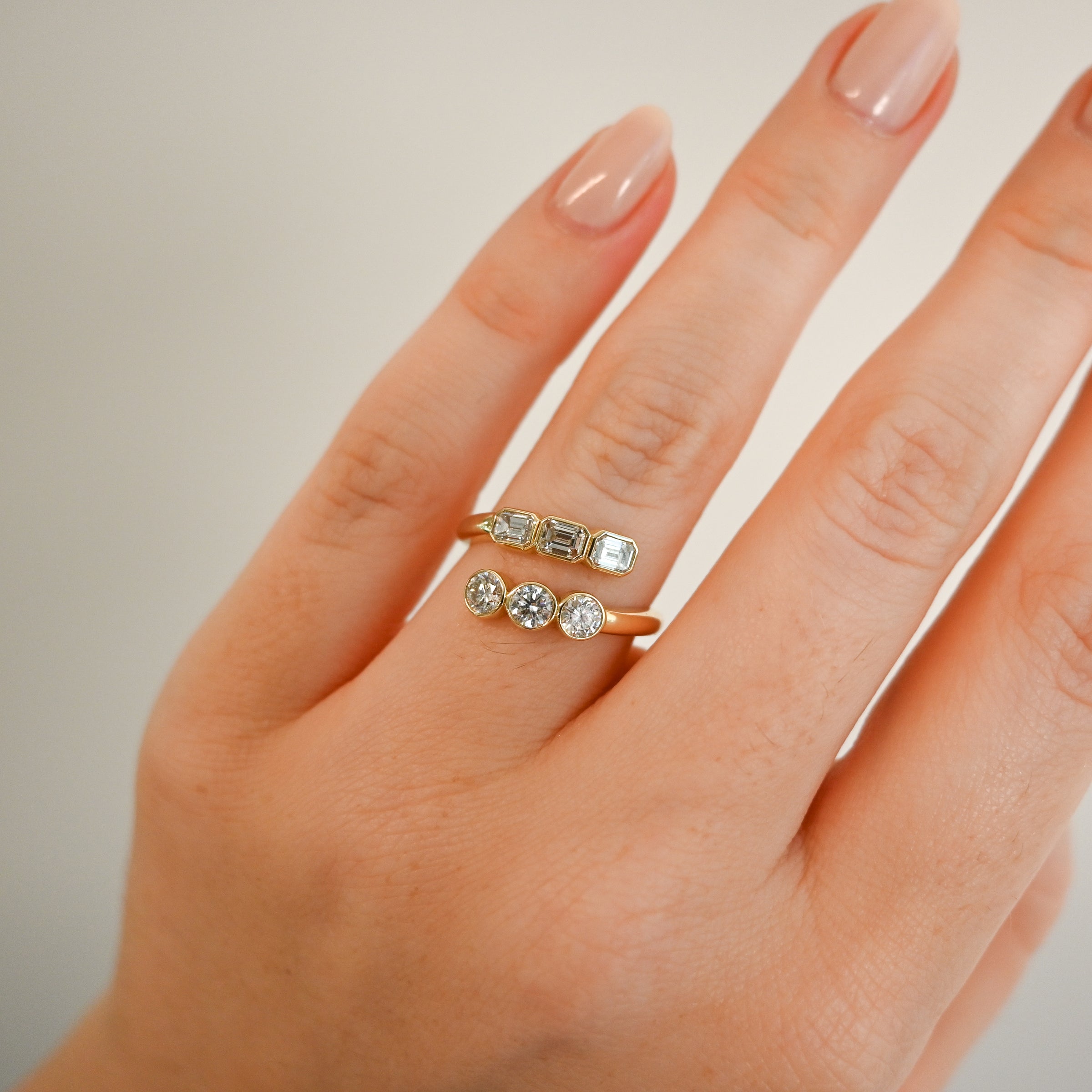 Fancy Bezel Round and Emerald Bypass Ring