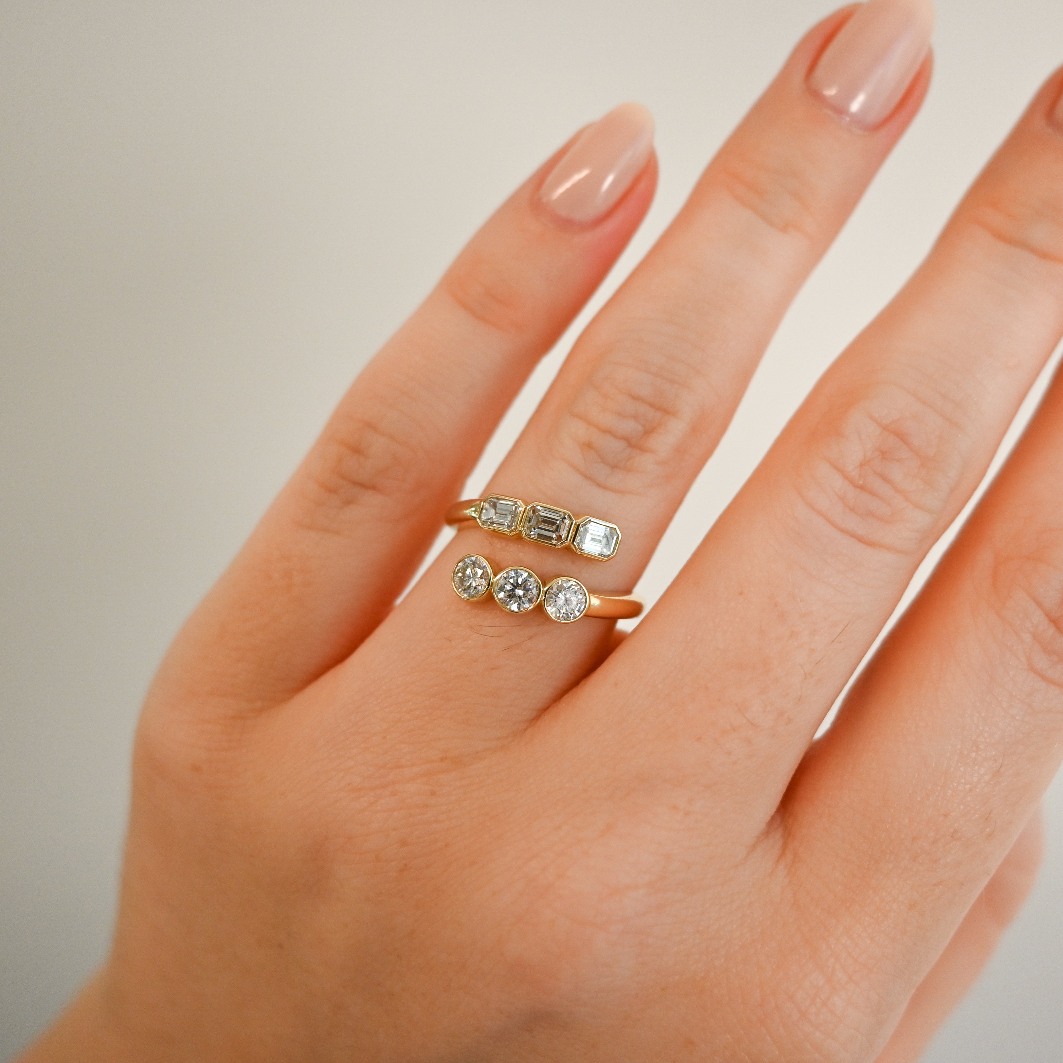 Fancy Bezel Round and Emerald Bypass Ring