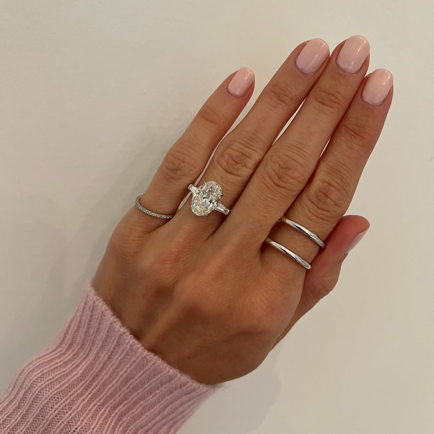 Oval Three-Stone with Tapered Baguette Side Stones Engagement Ring