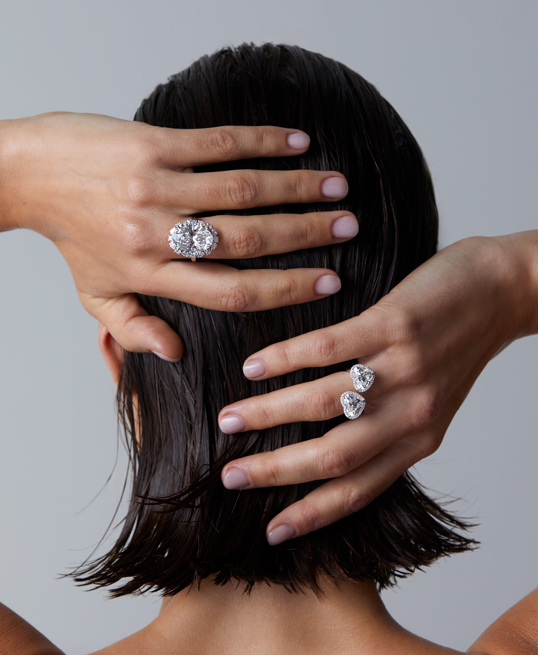 model wearing 2 engagement rings