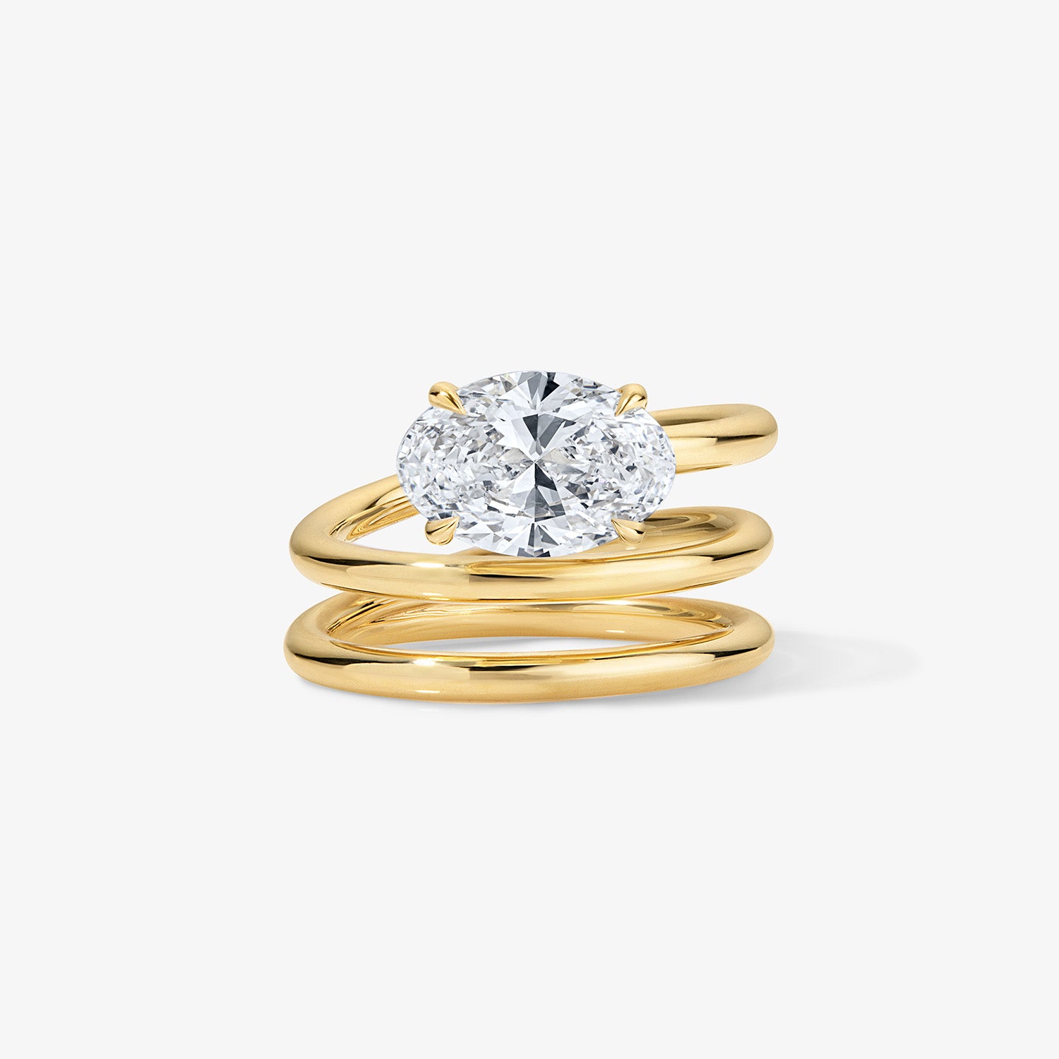 Gold Coil Ring with Oval Diamond Center