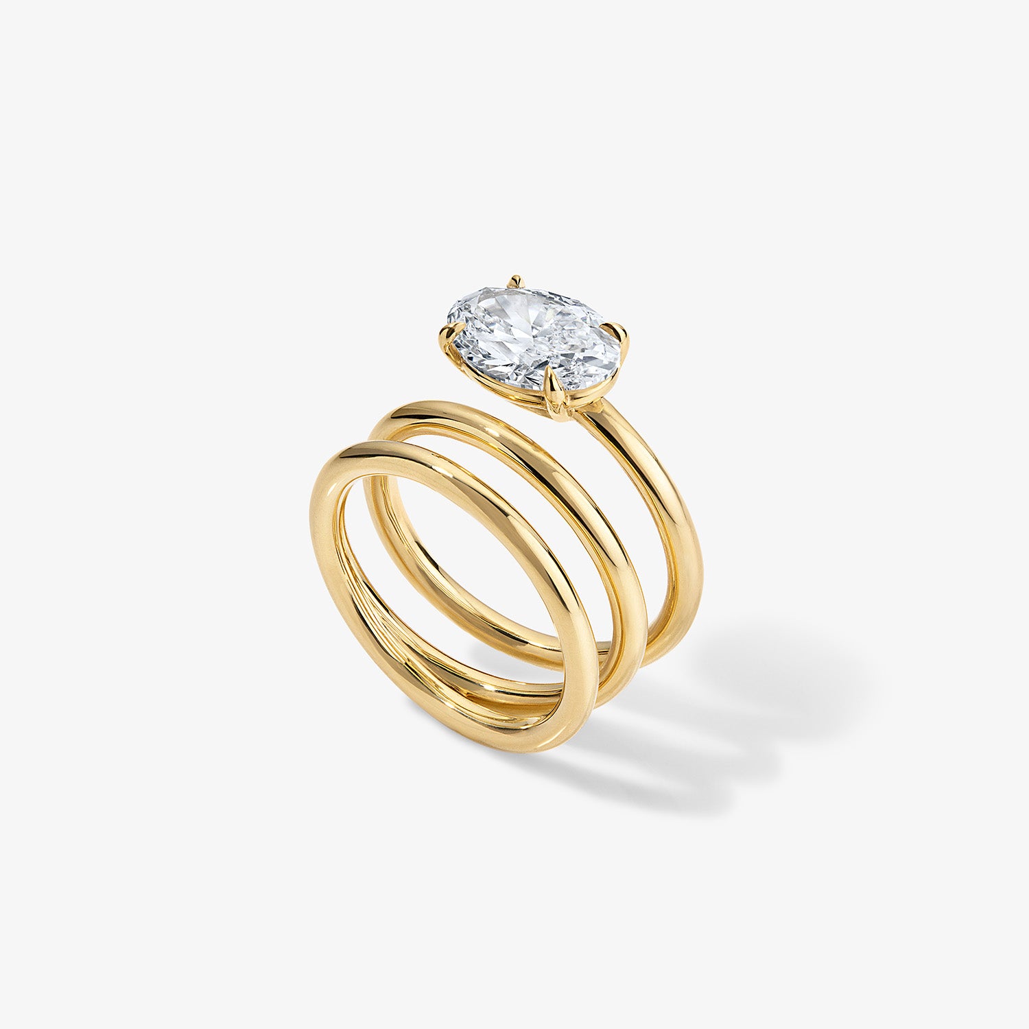 Gold Coil Ring with Oval Diamond Center