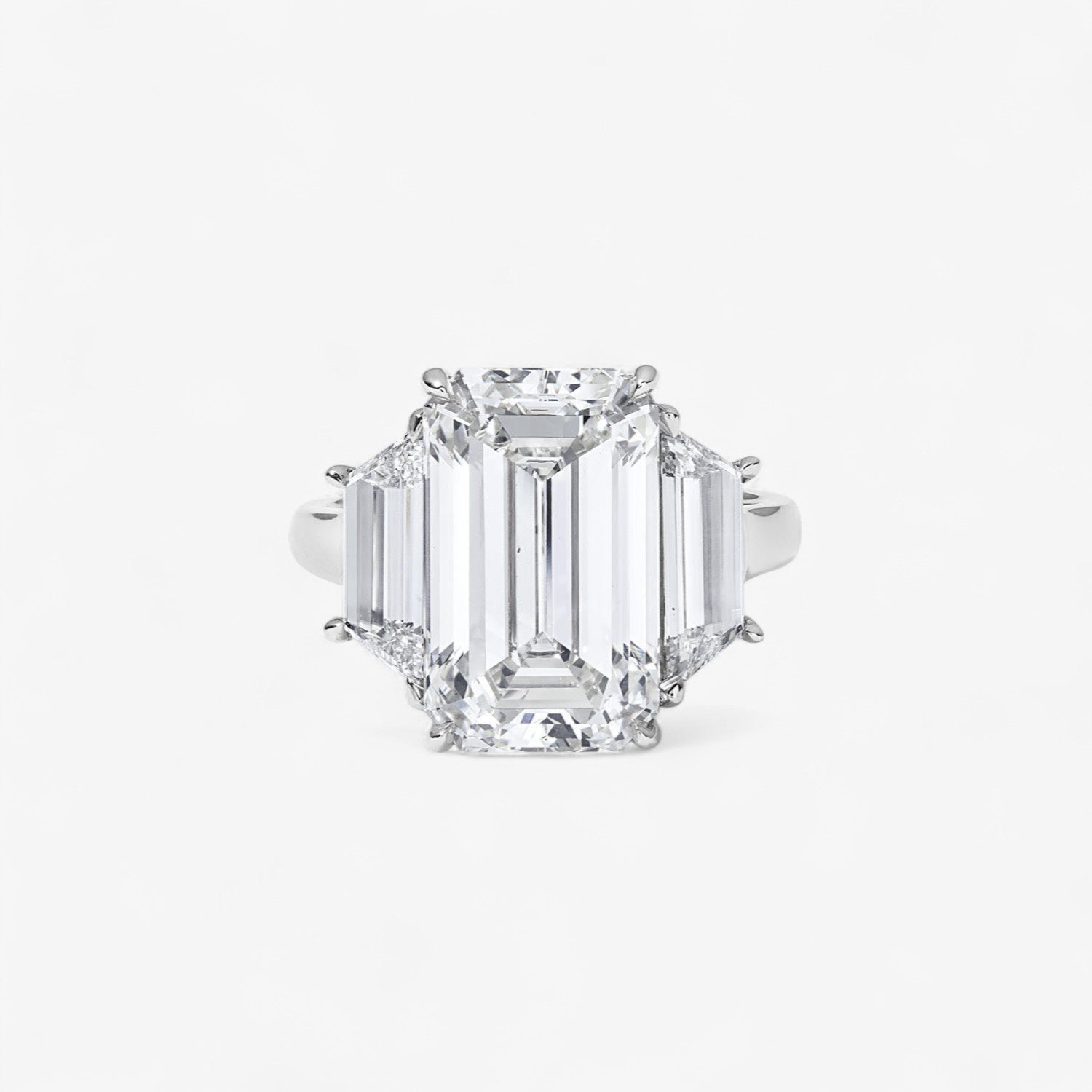 7.30CT Emerald Cut Three-Stone Ring with Trapezoid Side Stones