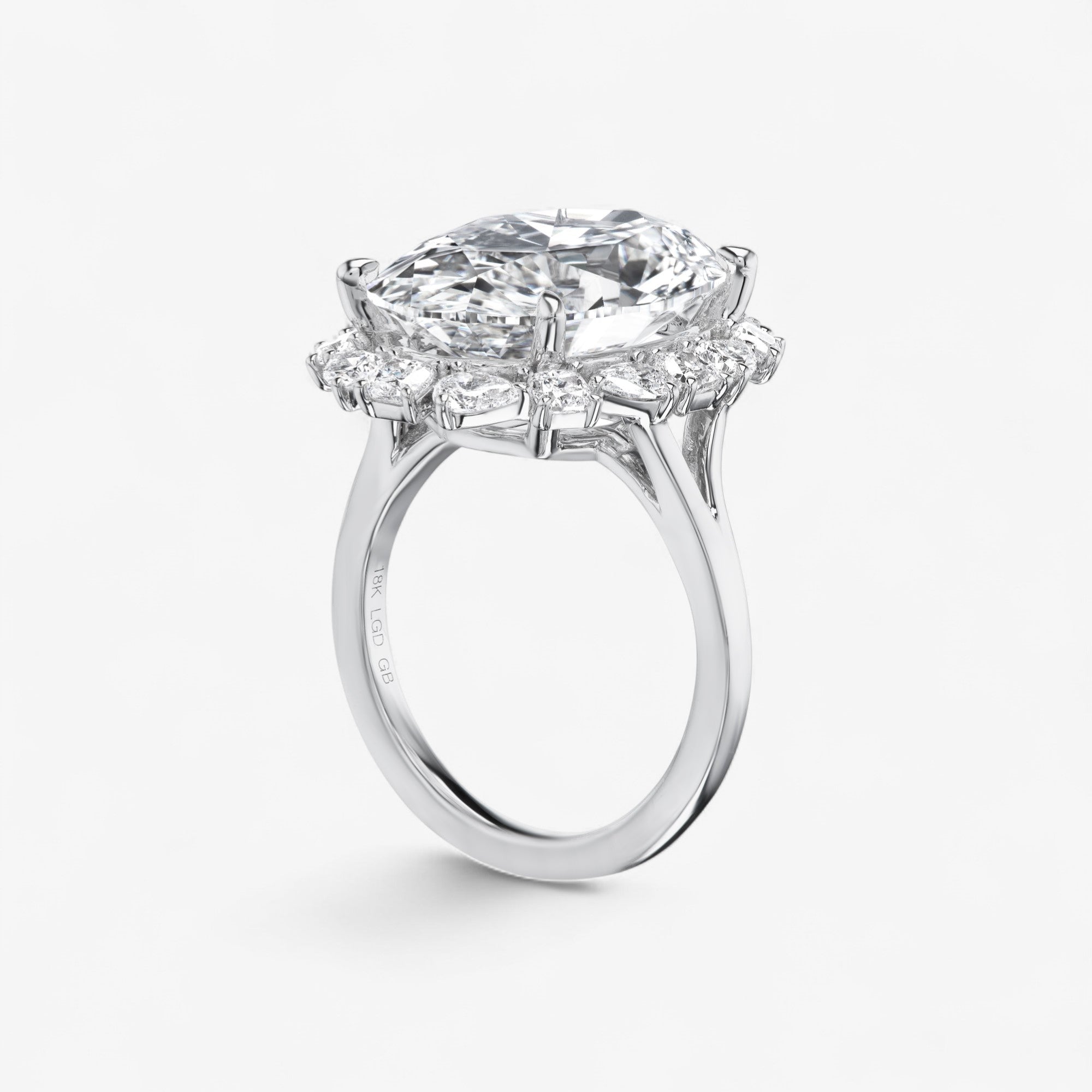 Oval Diamond Ring with Pear and Cushion Halo