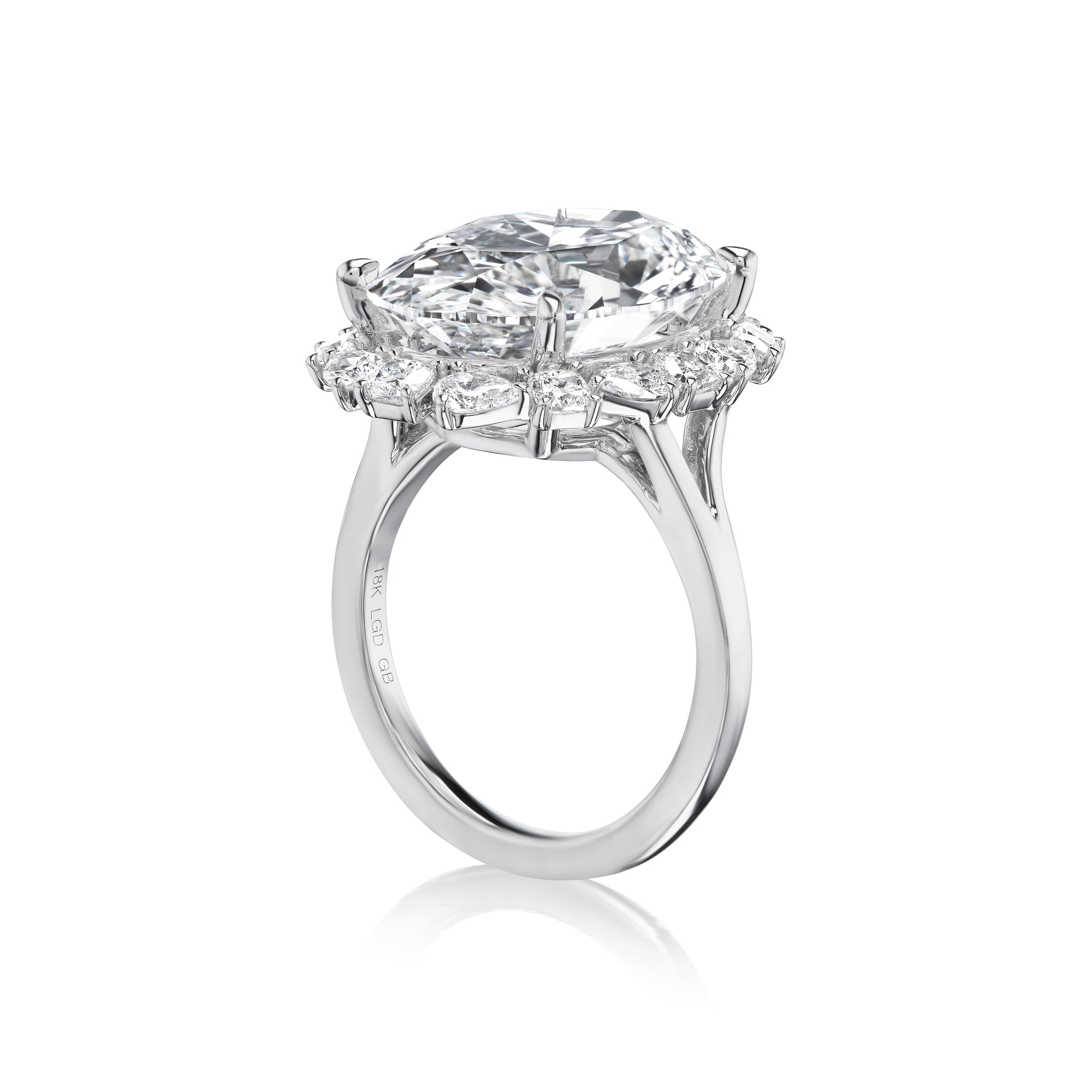 Oval Diamond Ring with Pear and Cushion Halo