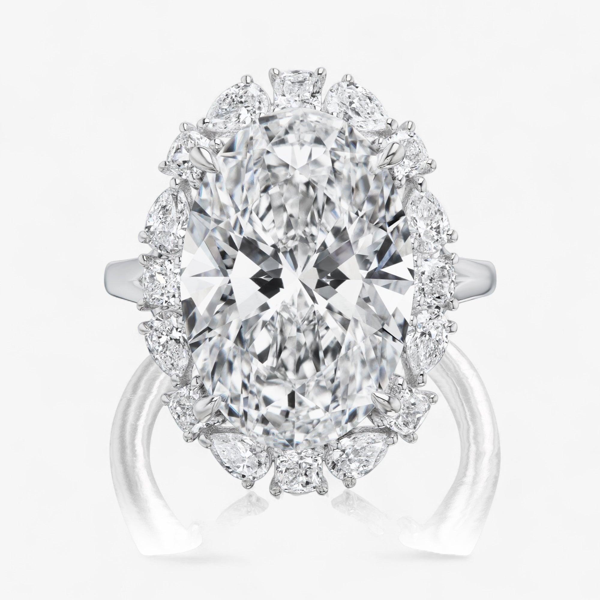 Oval Diamond Ring with Pear and Cushion Halo