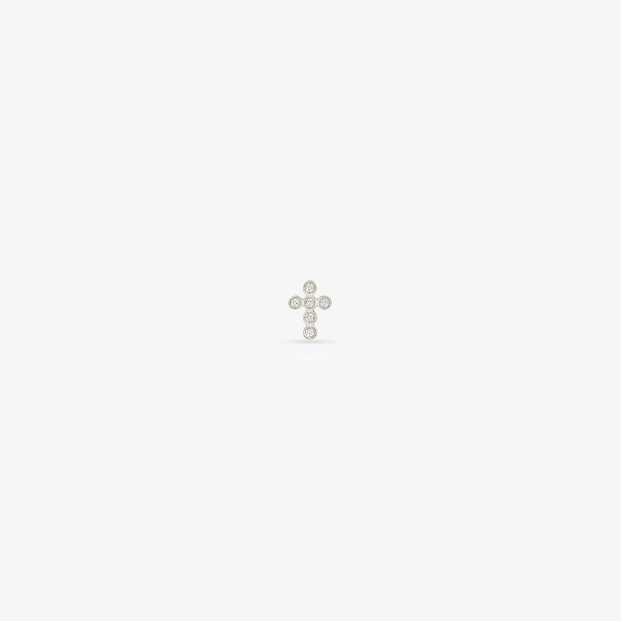 tiny bezel diamond cross studs in wg single