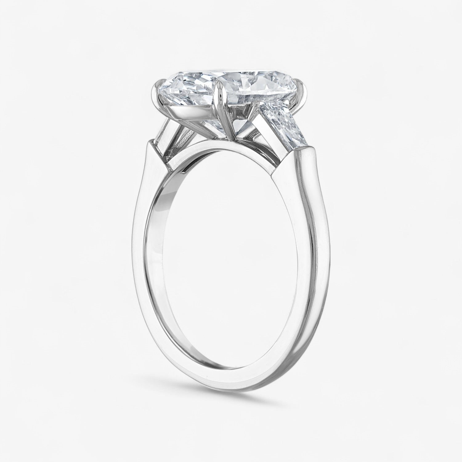 Oval Three-Stone with Tapered Baguette Side Stones Engagement Ring