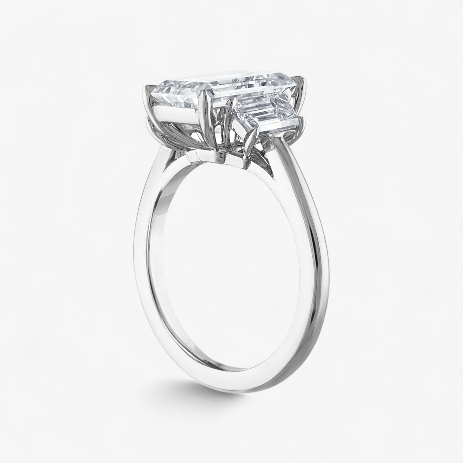 Emerald Cut Three-Stone with Trapezoid Side Stones Engagement Ring