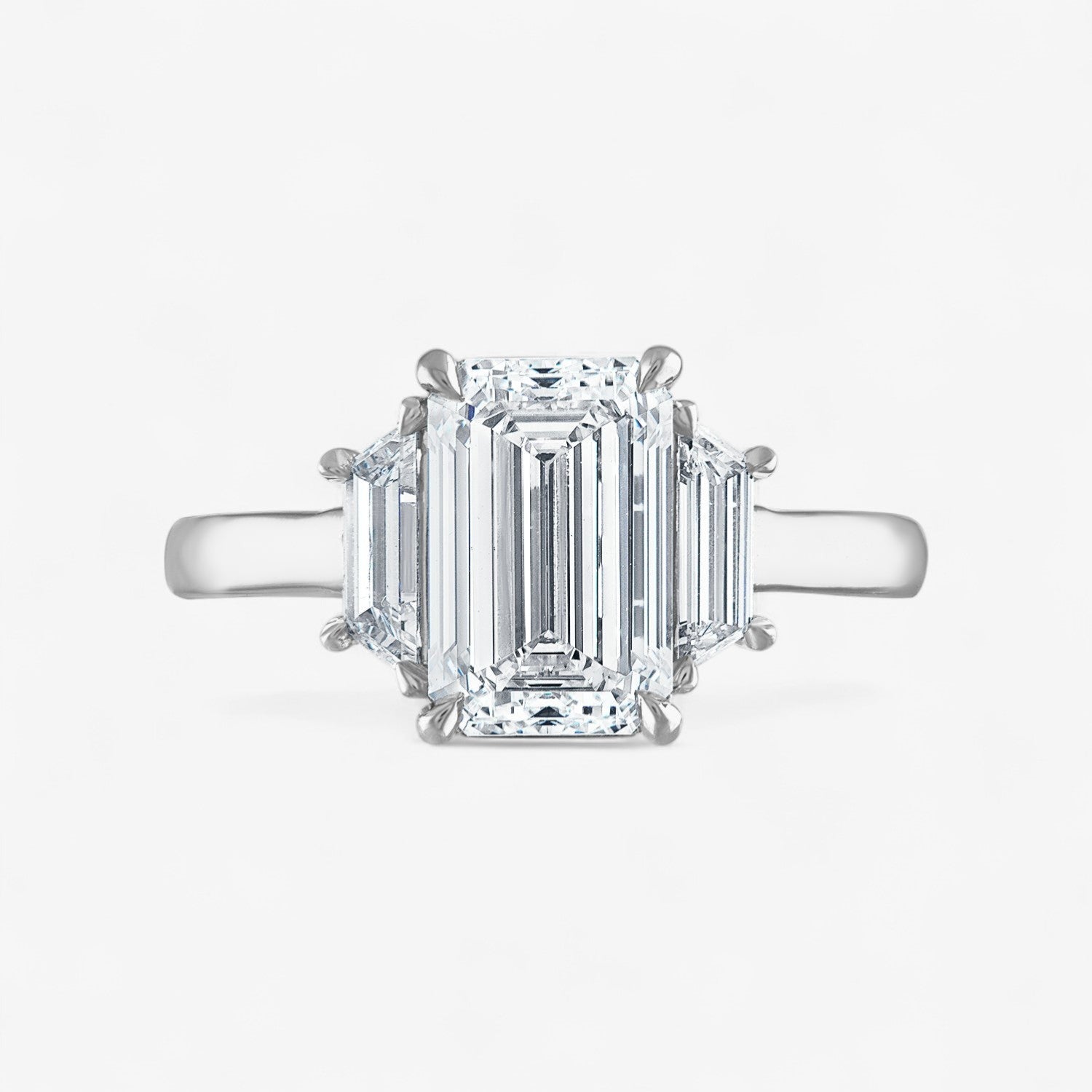 Signature Emerald Cut Three-Stone Engagement Ring with Trapezoid Side Stones