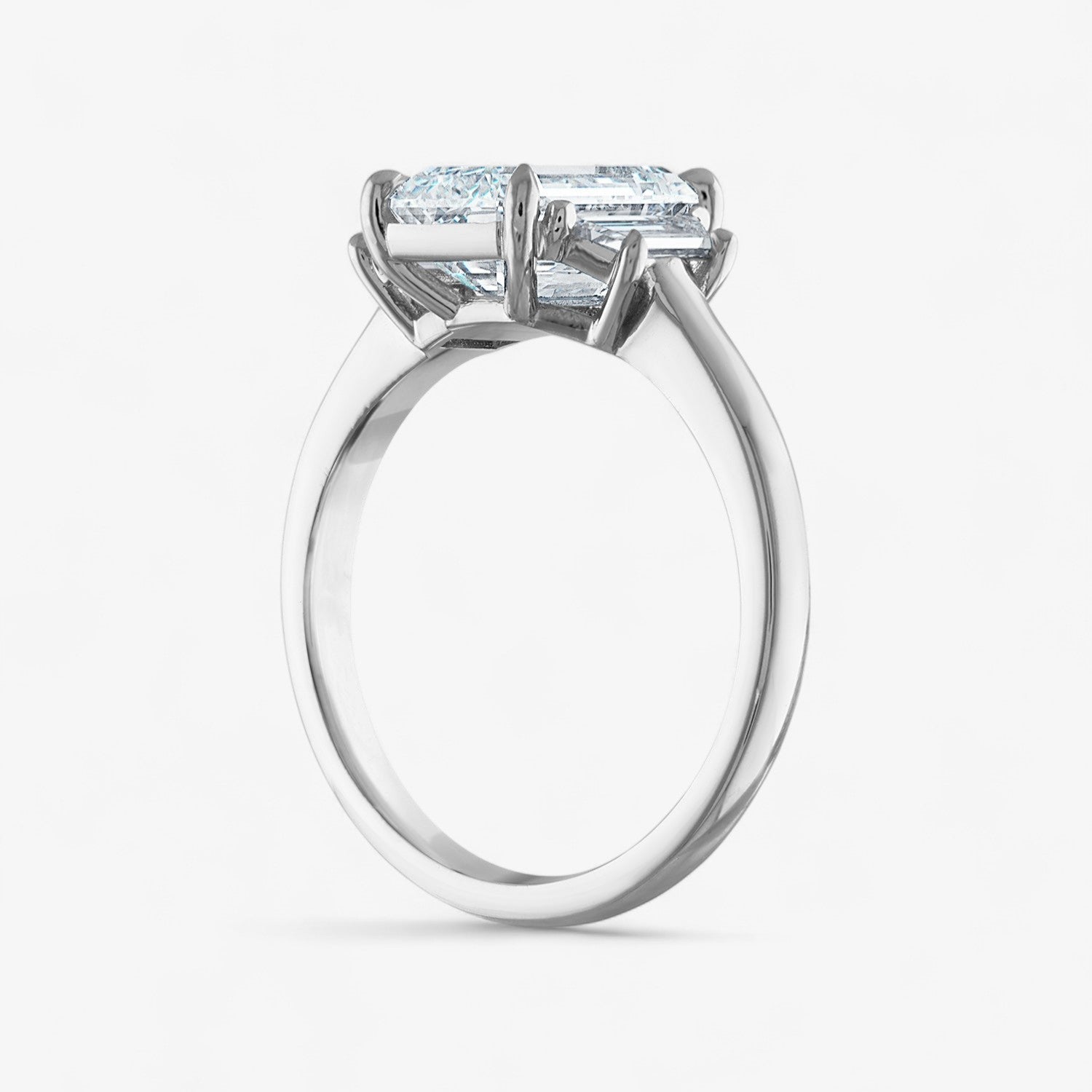 Signature Emerald Cut Three-Stone Engagement Ring with Trapezoid Side Stones