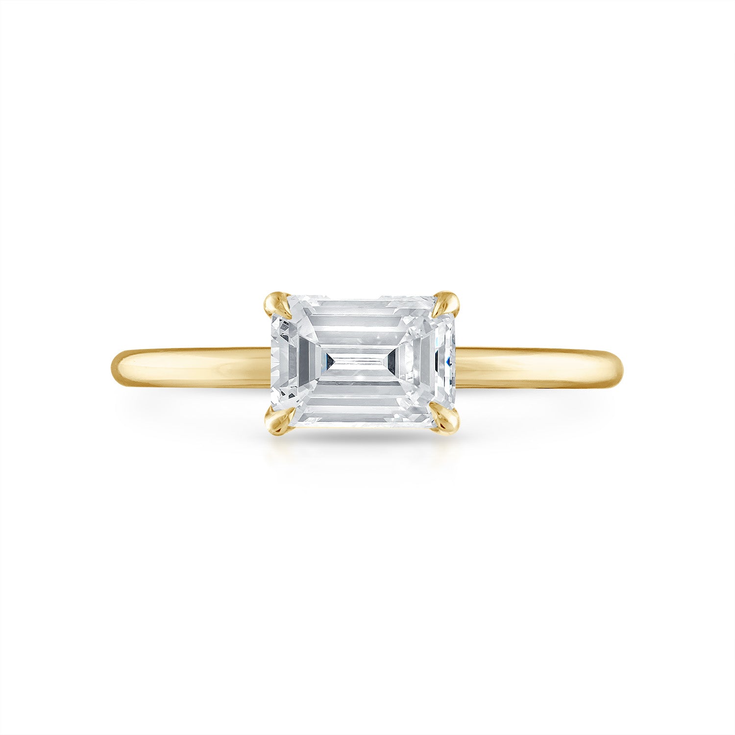 Sideways Emerald Solitaire Engagement Ring in Yellow Gold